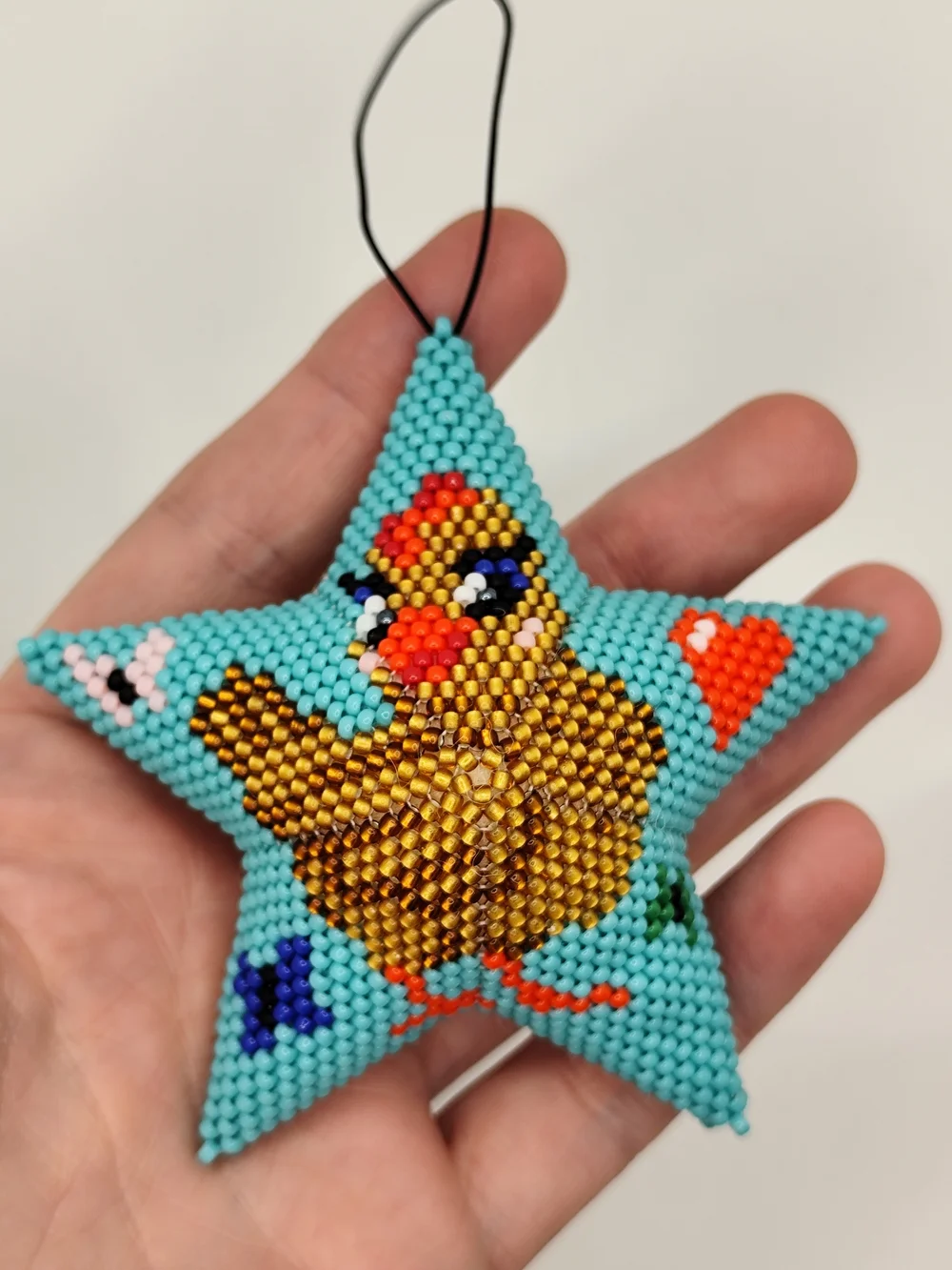 Handcrafted Turquoise Star Bird Ornament with Gold Chicken Design